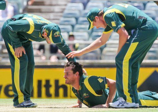 Australian fast bowler Clint McKay (C) is congratulated by his team-mates on February 1, 2013