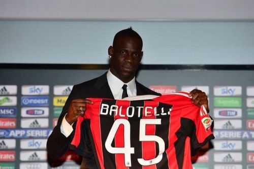 Italian striker Mario Balotelli poses with his AC Milan's team jersey on February 1, 2013 at San Siro Stadium in Milan