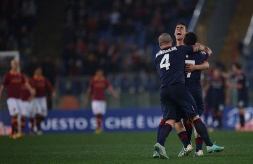 Cagliari's forward Marco Sau celebrates with teamates after scoring in Rome's Olympic Stadium on Febuary 1, 2013