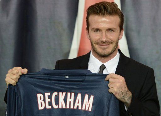 David Beckham presents his new jersey after a news conference on January 31, 2013 in Paris