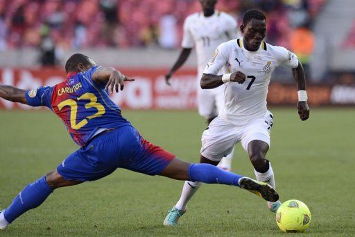 Ghana&#039;s midfielder Christian Atsu (R) clashes with Cape Verde&#039;s defender Carlitos on February 2, 2013
