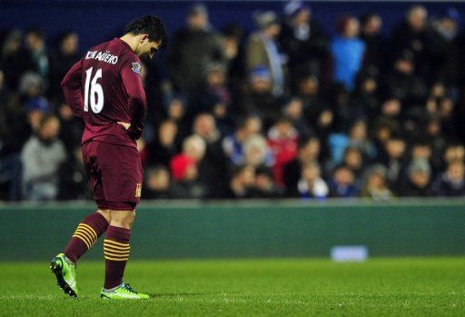 Manchester City&#039;s Sergio Aguero reacts after missing a chance at goal against Queens Park Rangers, January 29, 2013