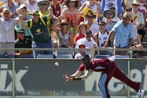 West Indies&#039; Kieron Pollard attempts a boundary catch off the bat by Australia&#039;s George Bailey on February 3, 2013