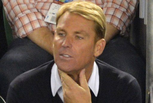 Shane Warne watches the  Australian Open tennis tournament in Melbourne on January 25, 2013