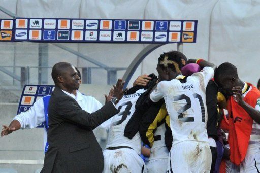 Kwesi Appiah (left) celebrates with his players after Ghana beat Cape Verde in Port Elizabeth on February 2, 2013
