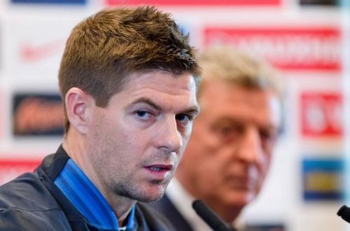 England's manager Roy Hodgson (R) and captain Steve Gerrard, pictured in London, on February 5, 2013