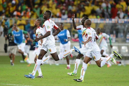 Malian players celebrate defeating South Africa in the African Cup of Nations 2013 on February 2, 2013 in Durban