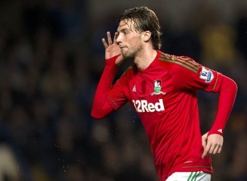 Swansea City's midfielder Miguel Michu celebrates after scoring during a match in London on January 9, 2013