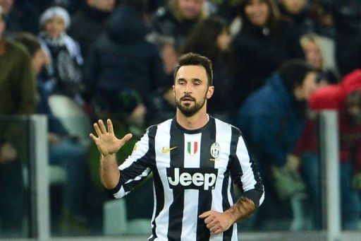 Juventus&#039; forward Mirko Vucinic celebrates after scoring a goal in Turin on February 9, 2013