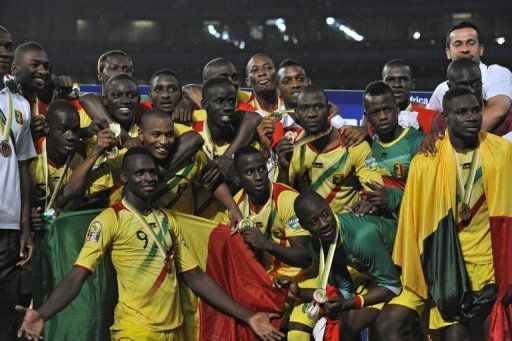 Malian players celebrate with their bronze medals on February 9, 2013 in Port Elizabeth