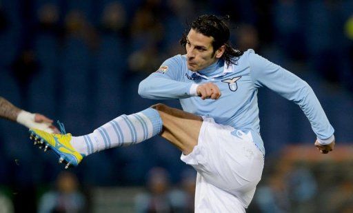 Lazio&#039;s forward Sergio Floccari kicks to score on February 9, 2013 at Rome&#039;s Olympic stadium