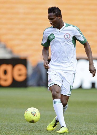 Nigeria&#039;s John Obi Mikel controls a ball during a training session at Soccer City in Soweto on February 9, 2013