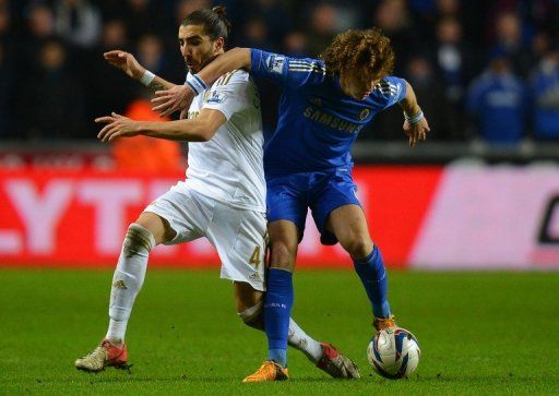 Swansea defender Chico Flores (left) and Chelsea&#039;s David Luiz at The Liberty stadium in Cardiff, January 23, 2013