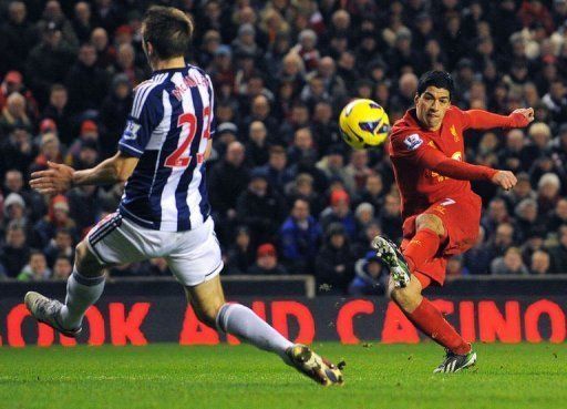 Liverpool forward Luis Suarez takes a shot during the game against West Bromwich Albion at Anfield on February 11, 2013
