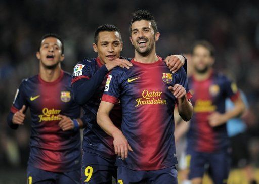 Barcelona forward David Villa (right celebrates after scoring against Cordoba CF in Barcelona on January 10, 2013