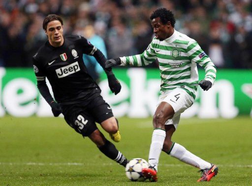 Juventus striker Alessandro Matri (left) challenges Celtic&#039;s Efe Ambrose at Celtic park in Glasgow on February 12, 2013