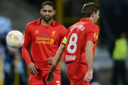 Liverpool&#039;s Steven Gerrard (R) and Glen Johnson react in St. Petersburg on February 14, 2013