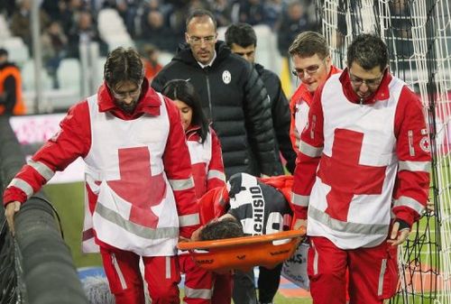 Juventus' Claudio Marchisio is carried off the playing field by medical staff, in Turin, on January 6, 2013