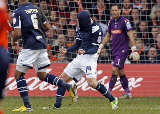Millwall midfielder James Henry (centre) celebrates scoring the opening goal against Luton on February 16, 2013