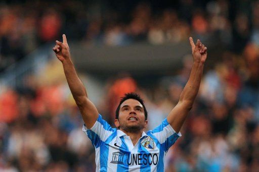 Malaga&#039;s forward Javier Saviola celebrates after scoring in Malaga on February 16, 2013