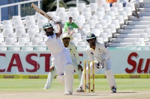 Hashim Amla plays a shot on day four of the second Test match against Pakistan in Cape Town on February 17, 2013