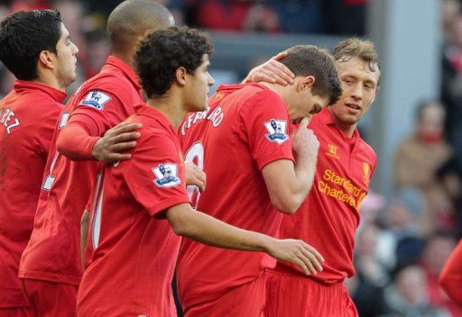 Liverpool&#039;s Steven Gerrard (2nd R) celebrates with teammates at Anfield in Liverpool on February 17, 2013