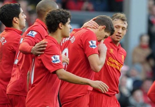 Liverpool's Steven Gerrard (2nd R) celebrates with teammates at Anfield in Liverpool on February 17, 2013