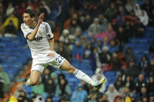 Real Madrid&#039;s Angel di Maria jumps for the ball at the Santiago Bernabeu stadium in Madrid on February 17, 2012