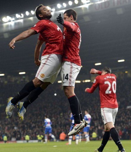 Javier Hernandez (R) and team-mate Anderson celebrate the Mexican forward&#039;s goal, at Old Trafford, on February 18, 2013