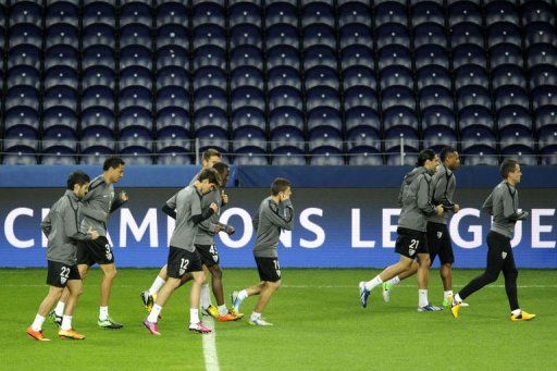 Malaga&#039;s players run during a training session at Dragao Stadium in Porto, on February 18, 2013