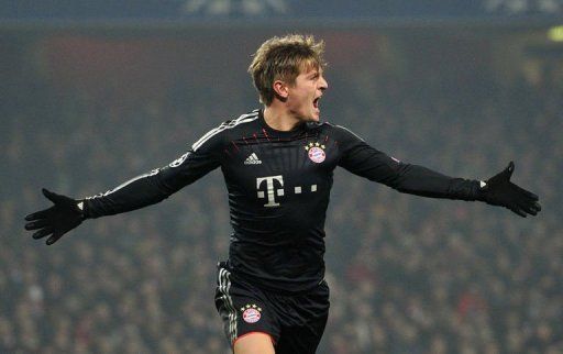 Bayern Munich&#039;s Toni Kroos celebrates scoring the opening goal in north London on February 19, 2013