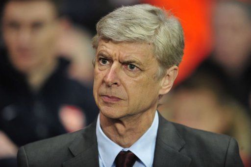 Arsenal manager Arsene Wenger takes his seat in north London on February 19, 2013