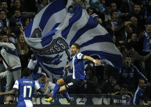 Porto&#039;s Joao Moutinho celebrates after scoring in Porto on February 19, 2013