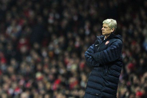 Arsene Wenger watches the action from the touchline during the clash with Bayern Munich on February 19, 2013