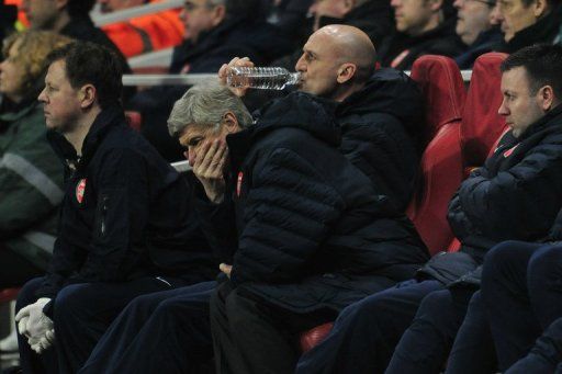 Arsene Wenger cuts a frustrated figure as he watches his side in the home defeat to Bayern Munich, on February 19, 2013