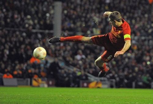 Liverpool's midfielder Steven Gerrard shoots in Liverpool on February 21, 2013