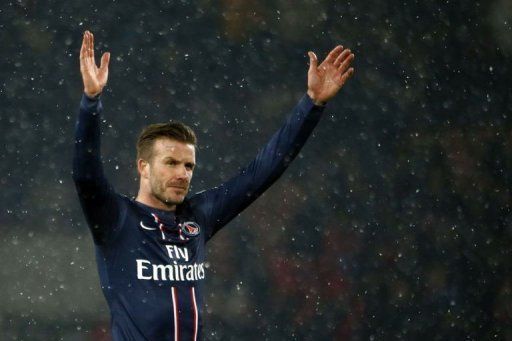 Paris Saint-Germain&#039;s David Beckham waves on February 24, 2013 at the Parc des Princes stadium in Paris