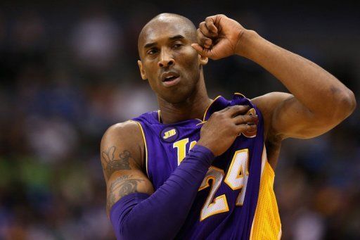 Bryant reaches milestone, Lakers beat Mavs