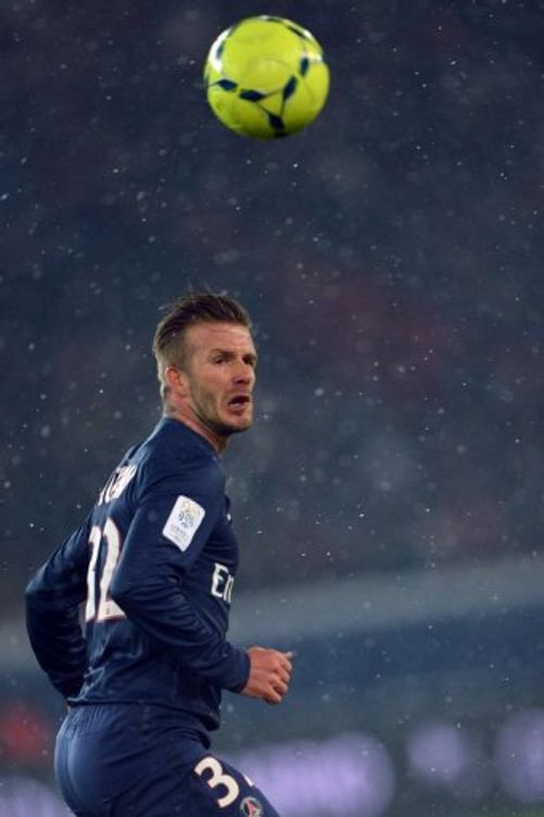 David Beckham eyes the ball during PSG's game against Olympique de Marseille in Paris on February 24