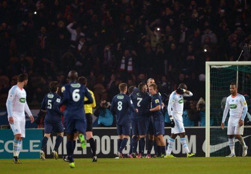 Paris Saint-Germain&#039;s players celebrate after scoring the second goal on February  27, 2013 at the Parc-des-Princes