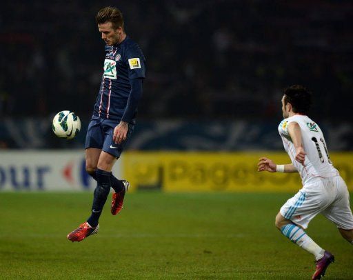 Paris Saint-Germain&#039;s David Beckham controls the ball on February 27, 2013 at the Parc des Princes