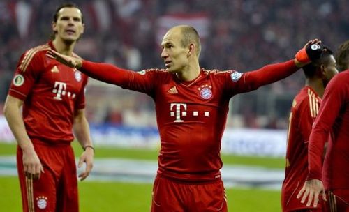 Arjen Robben (C) celebrates Bayern Munich's 1-0 win over Borussia Dortmund, in Munich, on February 27, 2013