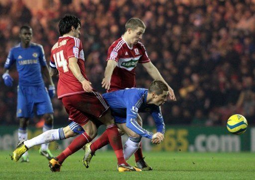 Chelsea&#039;s Fernando Torres (C) gets squeezed out during a match against Middlesborough, on February 27, 2013