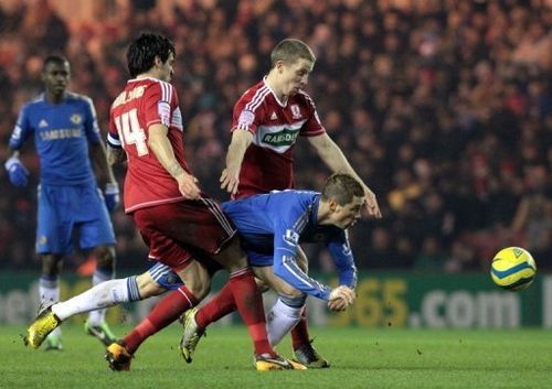 Chelsea's Fernando Torres (C) gets squeezed out during a match against Middlesborough, on February 27, 2013