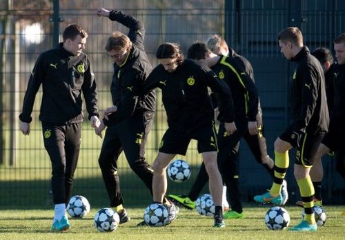 Dortmund's head coach Juergen Klopp (2nd L), seen with players during a training session in Dortmund, on March 4, 2013