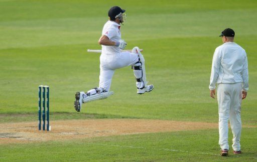 England&#039;s Nick Compton celebrates his maiden Test century, against New Zealand, in Dunedin, on March 9, 2013