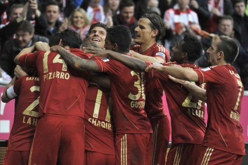 Bayern Munich player celebrate their win against Fortuna in Munich on March 9, 2013