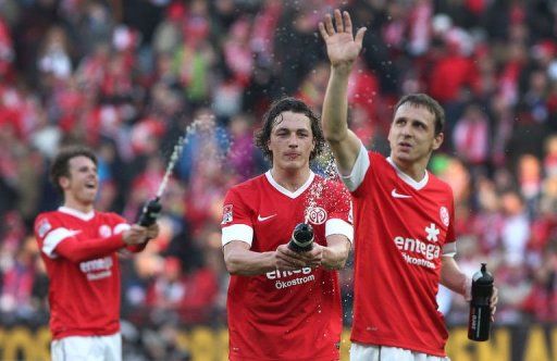 Mainz&#039; players celebrate winning 1-0 in Mainz, southwestern Germany, on March 9, 2013