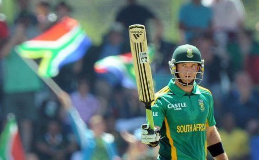 Colin Ingram raise his bat after scoring a half century against Pakistan in Bloemfontein on March 10, 2013
