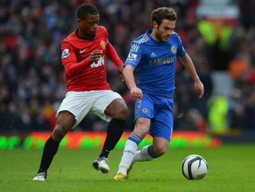 Manchester United's Patrice Evra (L) vies with Chelsea's Juan Mata at Old Trafford, on March 10, 2013